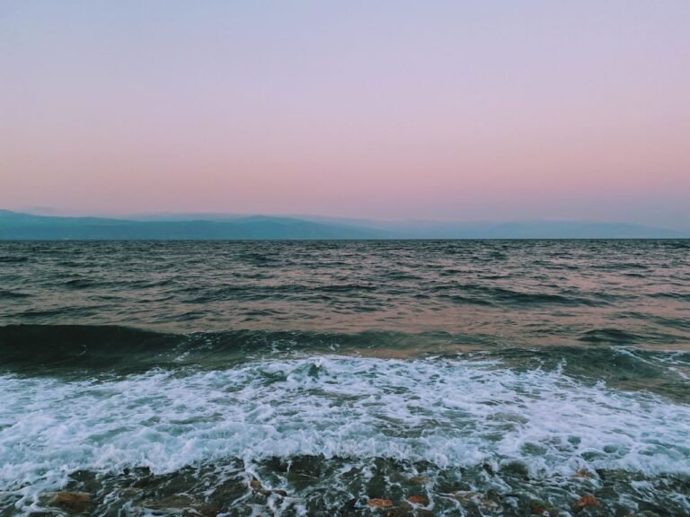 Capture the calmness of the sea at twilight with a pink horizon in Bursa, Türkiye.