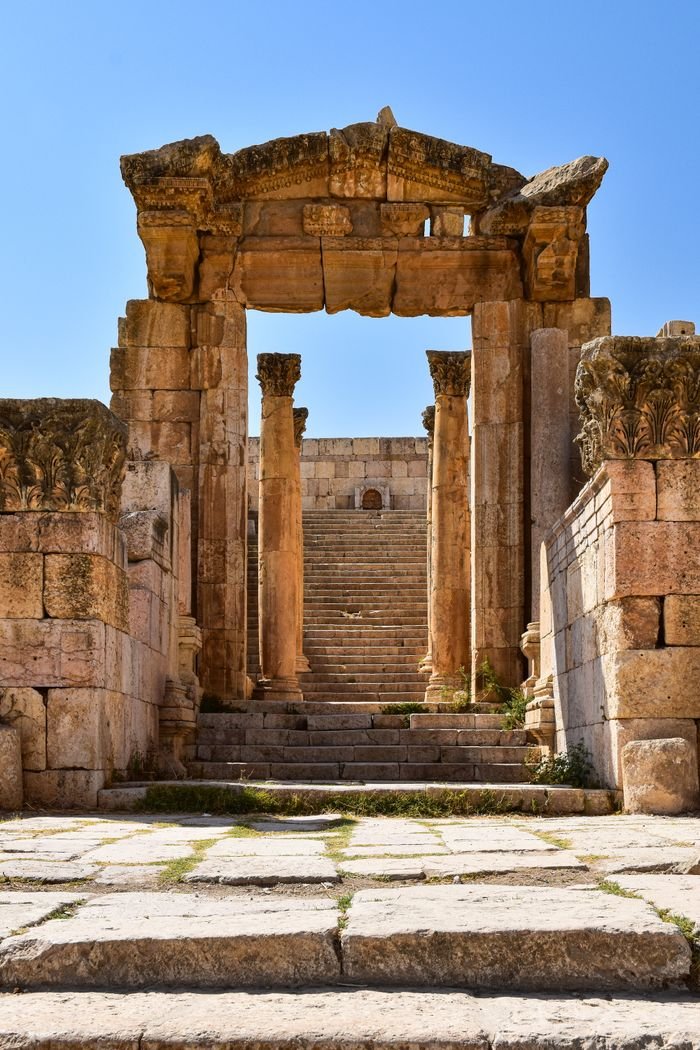 1 Day Jerash A striking view of the ancient entrance at Jerash ruins, showcasing historical architecture.