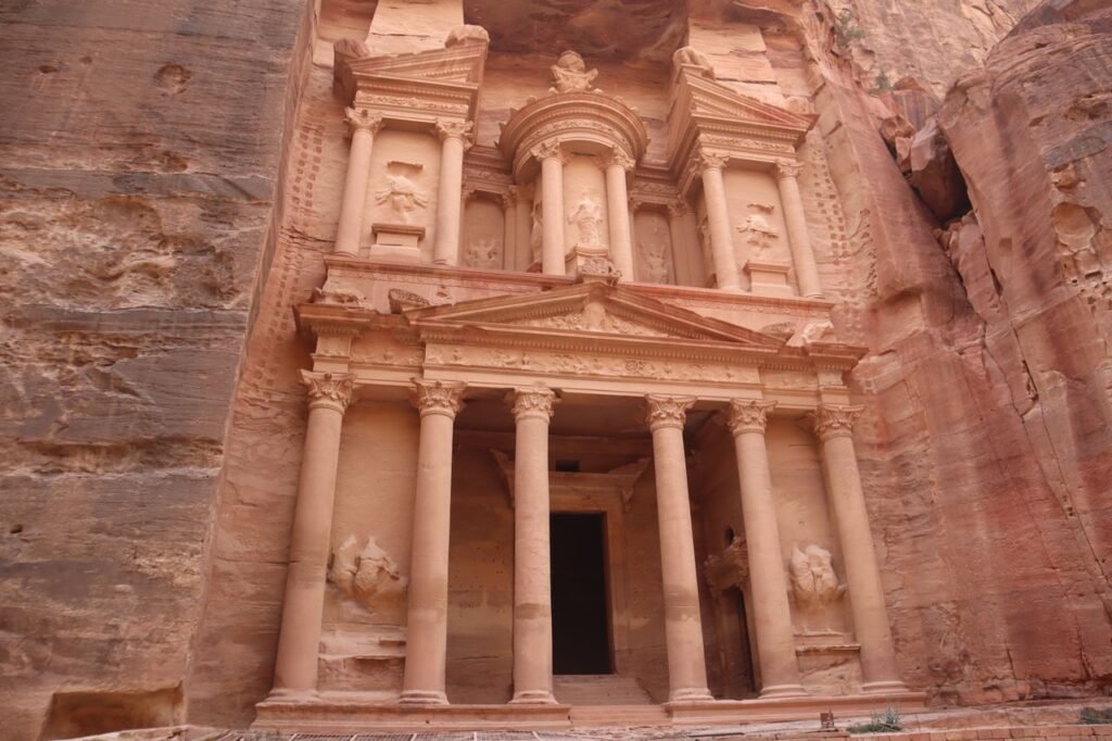 Is the Jordan Pass Worth It? Complete 2026 Guide & Cost Analysis? Explore the ancient rock-carved Al-Khazneh treasury in Petra, Jordan, a UNESCO World Heritage Site.